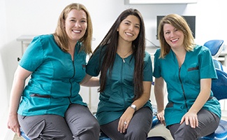 Three female dental team members