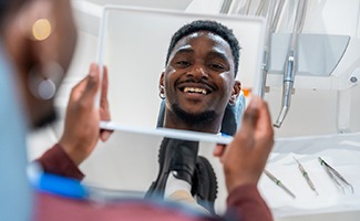 Young man pleased with his new smile