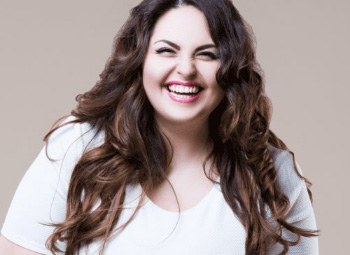 Laughing woman with long curly brown hair