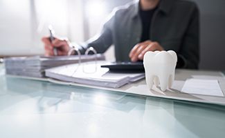 a patient filling out a dental insurance form