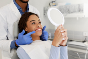 a patient smiling in a mirror