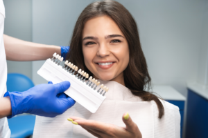 a patient admiring her new veneers